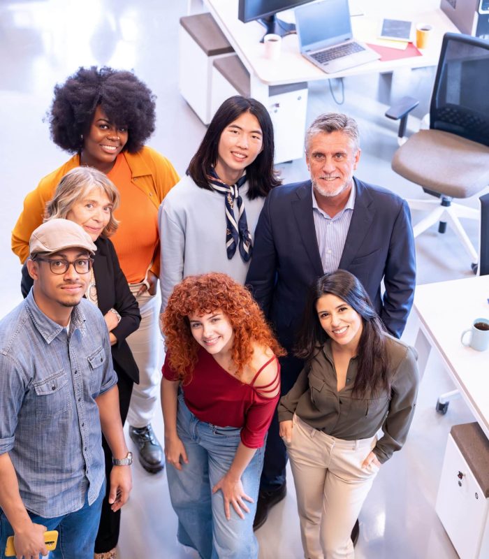 Diverse business team smiling while posing together in the office. Business concept.