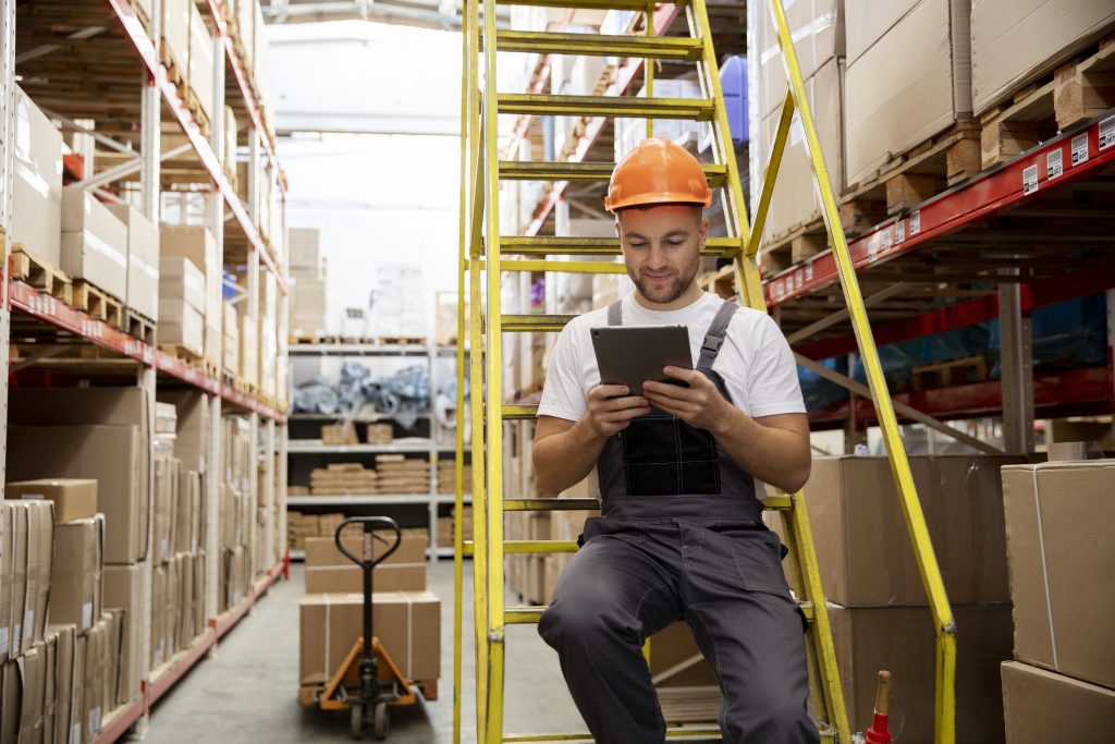 Warehouse worker managing operations
